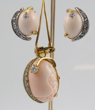 An 18ct yellow gold diamond and coral pendant and chain together with  a pair of matching ear clips 
