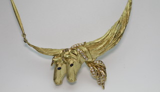 An 18ct yellow gold diamond and sapphire necklace, set with 2 race horse heads on a fancy link chain, 52 grams