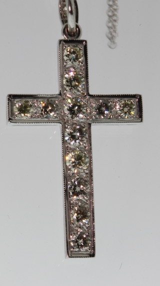 A white gold 12 stone diamond set cross on an 18ct white gold chain, approx. 1.5ct 