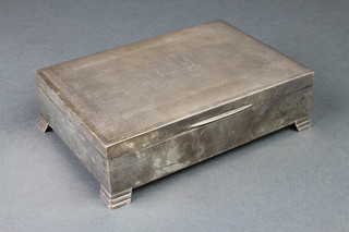 A rectangular engine turned silver cigarette box, Sheffield 1939, 6 1/2" x 4 1/2" 