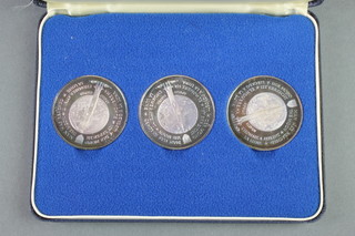 A cased set of 3 commemorative coins Mans First Landing on the Moon, 94 grams 