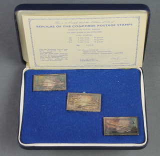 A cased set of 3 silver Concord postage stamps, 48 grams