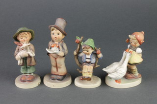 4 Hummel figures - Street Singer 5", The Lost Sheep 4 1/4", Goose Girl 4" and Apple Tree Boy 4" 