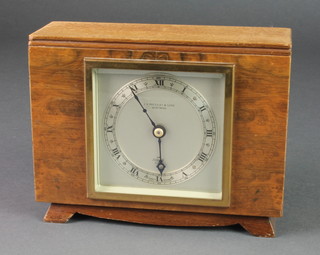 Elliott, a 1950's timepiece with silvered dial and Roman numerals contained in a walnut case 