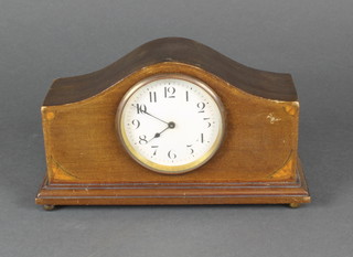 A bedroom timepiece with paper dial and Arabic numerals contained in an arched inlaid mahogany case 