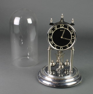 A German chrome 400 day clock with black dial complete with dome 