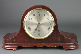An 8 day striking mantel clock with silvered dial and Arabic numerals contained in a mahogany Admirals hat shaped case 