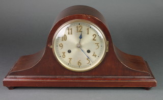 A 1930's striking mantel clock with silvered dial and Arabic numerals contained in a mahogany Admirals hat shaped case