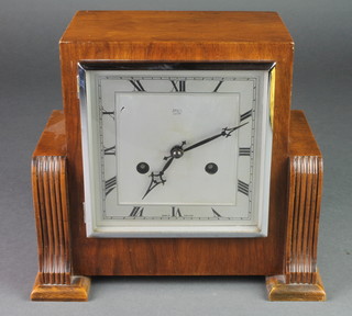Anvil, an Art Deco 8 day mantel clock with square silvered dial  and Roman numerals, contained in a walnut case 