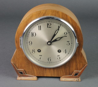An Art Deco 8 day striking mantel clock with silvered dial and Arabic numerals contained in a walnut case 