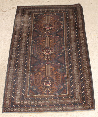 A brown ground Belouche rug 79 1/2" x 44" 