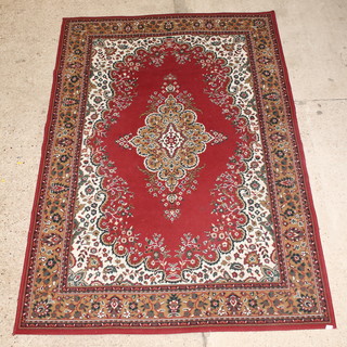 A red ground Persian style rug with central medallion 106" x 71" 
