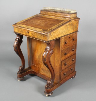 A Victorian walnut Davenport, the top fitted a stationery box with three-quarter gallery, the pedestal fitted 4 long drawers, raised on cabriole supports 33"h x 21"w x 21"d 