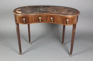 A walnut kidney shaped writing table with inset writing surface above 1 long and 2 short drawers, raised on square tapering supports 29"h x 39"w x 16"d 