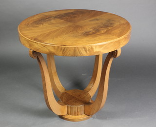 A circular Art Deco Continental 2 tier occasional table with quarter veneered top, raised on shaped supports 25"h x 26" dia. 