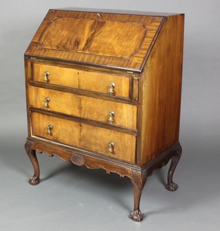 A Queen Anne style walnut bureau, the fall front revealing a well fitted interior above 3 long graduated drawers, raised on cabriole supports 39"h x 29"w x 16 1/2"d 