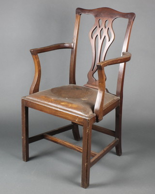 A Chippendale style mahogany carver chair with upholstered drop in seat, raised on square supports with H framed stretcher 