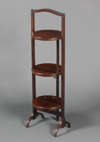 A mahogany circular 3 tier folding cake stand 35"h x 9 1/2" diam. 