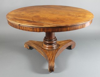 A Victorian mahogany snap top circular breakfast table raised on a turned column and triform base 28"h x 50 1/2" diam. 