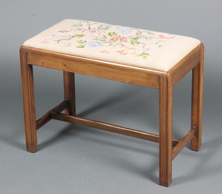 A 19th Century rectangular mahogany stool with upholstered Berlin wool work seat, raised on square supports with H framed stretcher 18"h x 24"w x 13"d 