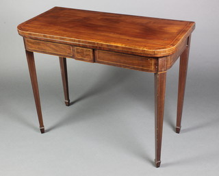 A Georgian mahogany D shaped card table with crossbanded top, raised on square tapering supports with satinwood stringing, inlaid throughout, 29"h x 36"w x 18"d 