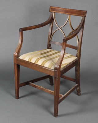 A Hepplewhite style mahogany bar back carver chair with lattice work mid rail and upholstered drop in seat, raised on square tapering supports with H framed stretcher