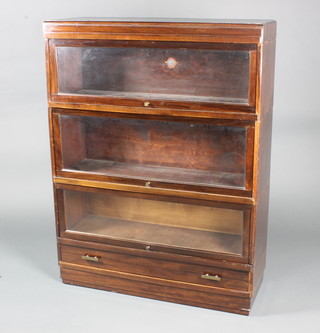 A mahogany 3 tier Globe Wernicke bookcase, the base fitted a drawer, the interior of the lid with Globe Wernicke label marked no.200 and rubber stamp mark War Manufacturer 34"h x 33"w x 11"