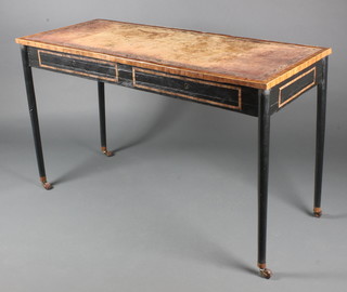A Regency style rectangular mahogany library table with inset brown leather writing surface, having a crossbanded top and raised on turned ebony supports 31"h x 51"w x 21"d 