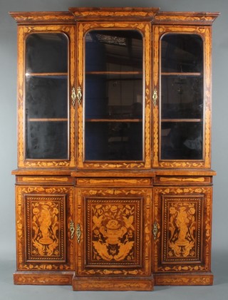 A Dutch style marquetry bookcase on cabinet, the upper section with moulded cornice fitted 3 cupboards enclosed by arch panelled doors, the base fitted 3 cupboards enclosed by arch panelled doors 81 1/2"h x 60"w x 18 1/2"d 