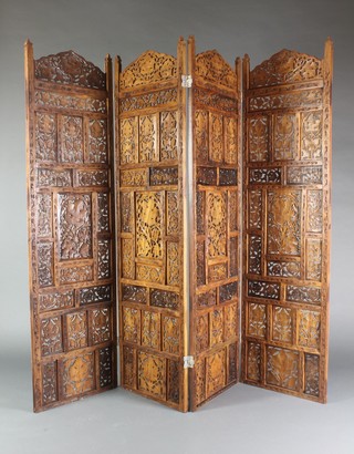 A Burmese pierced and carved hardwood 4 fold screen 67"h x 23" when closed x 79" when fully opened
