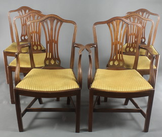 A set of 6 mahogany Hepplewhite style camel back dining chairs with upholstered drop in seats, 2 with arms, raised on square tapering supports