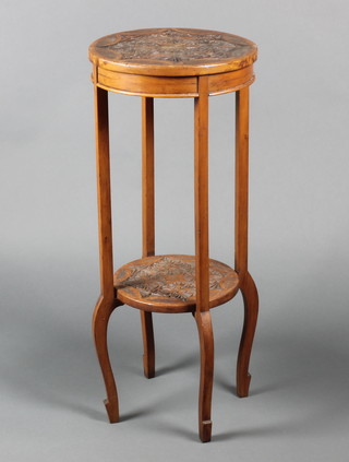 A circular carved walnut 2 tier jardiniere stand, raised on cabriole supports 31 1/2"h x 13"d 