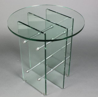 A 1960's circular chrome and plate glass pedestal table, raised on 3 rectangular uprights joined by 4 chrome panels 27"h x 26" diam.
