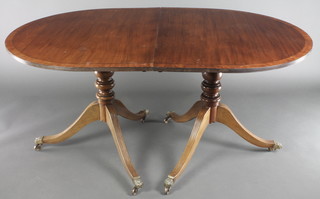 A Georgian style twin pillar D end dining table with 1 extra leaf, raised on pillar and tripod supports 29"h x 60"l x 78" with extra leaf x 38"2 