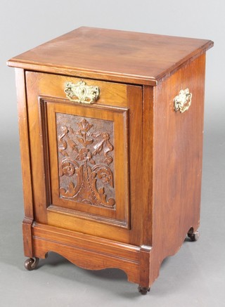 A Victorian carved walnut coal purdonium complete with metal liner and brass drop handles 22"h x 15"w x 14"d 