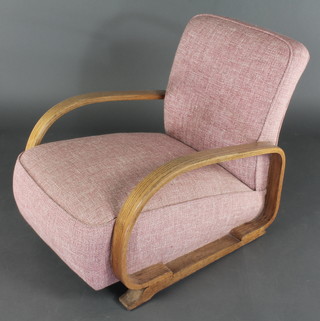 An Art Deco Heals style oak show frame easy chair upholstered in pink material
