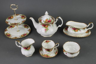 A Royal Albert Old Country Roses tea coffee and dinner service comprising  teapot, 8 tea cups, 6 coffee cups, 14 saucers, a milk jug, 2 tier cake stand, 6 dessert bowls, 7 small plates, 2 sandwich plates, a sugar bowl and slop bowl, 7 dinner plates, 6 dessert plates 