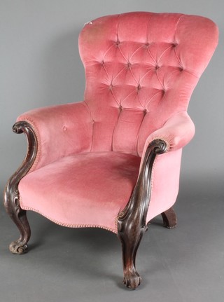 A Victorian mahogany show frame armchair upholstered in pink buttoned material on cabriole supports 