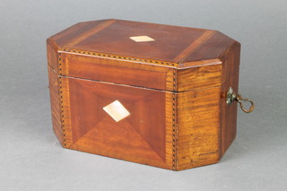 A Victorian inlaid mahogany lozenge shaped twin compartment tea caddy, the quarter veneered top inlaid a section of mother of pearl 4 1/2"h x 8"w x 5"d 