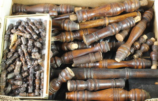 A collection of turned rosewood spindles etc 