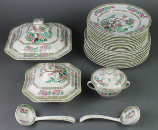 An Indian Tree pattern dinner service comprising 5 tureens and covers, 2 ladles, 1 small plate, 13 side plates, 12 medium plates, 9 dinner plates, 2 ladles, 12 soup bowls and 3 serving dishes 