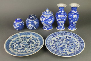 A pair of prunus oviform vases, 3 ginger jars and a pair of blue and white plates