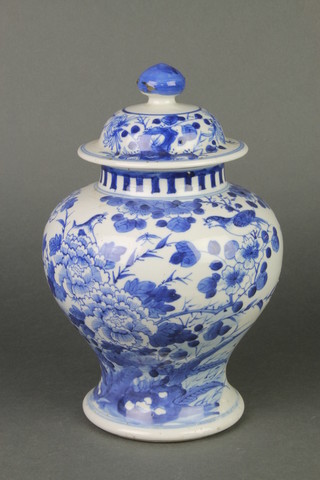 A Chinese blue and white oviform vase decorated with birds amongst flowering peony 8" 