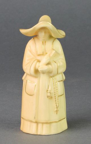 A Royal Worcester blush porcelain candle snuffer in the form of a Nun 3 3/4" 