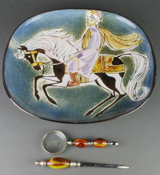 A Studio Pottery dish decorated with a figure on horseback 12", a pottery dish decorated with a horse 7", a Murano magnifying glass and paper knife 