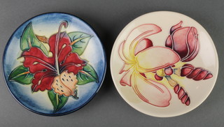 2 late Moorcroft circular dishes decorated with flowers 4 1/2", boxed 