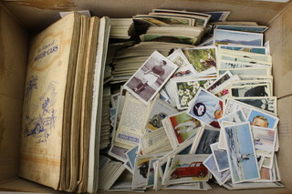 A collection of loose and other cigarette cards