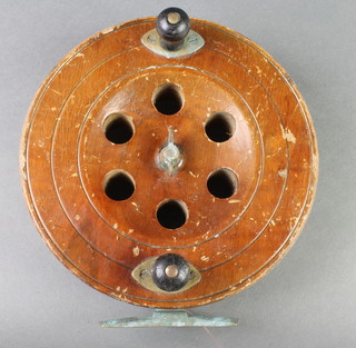 A large wooden and brass Eaton Son centre pin fishing reel