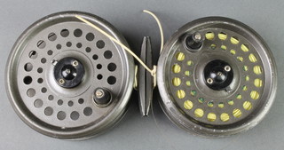 An Intrepid fly fishing reel and 1 other 