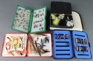 4 plastic fly boxes, a fly wallet containing a collection of various salmon and trout flies